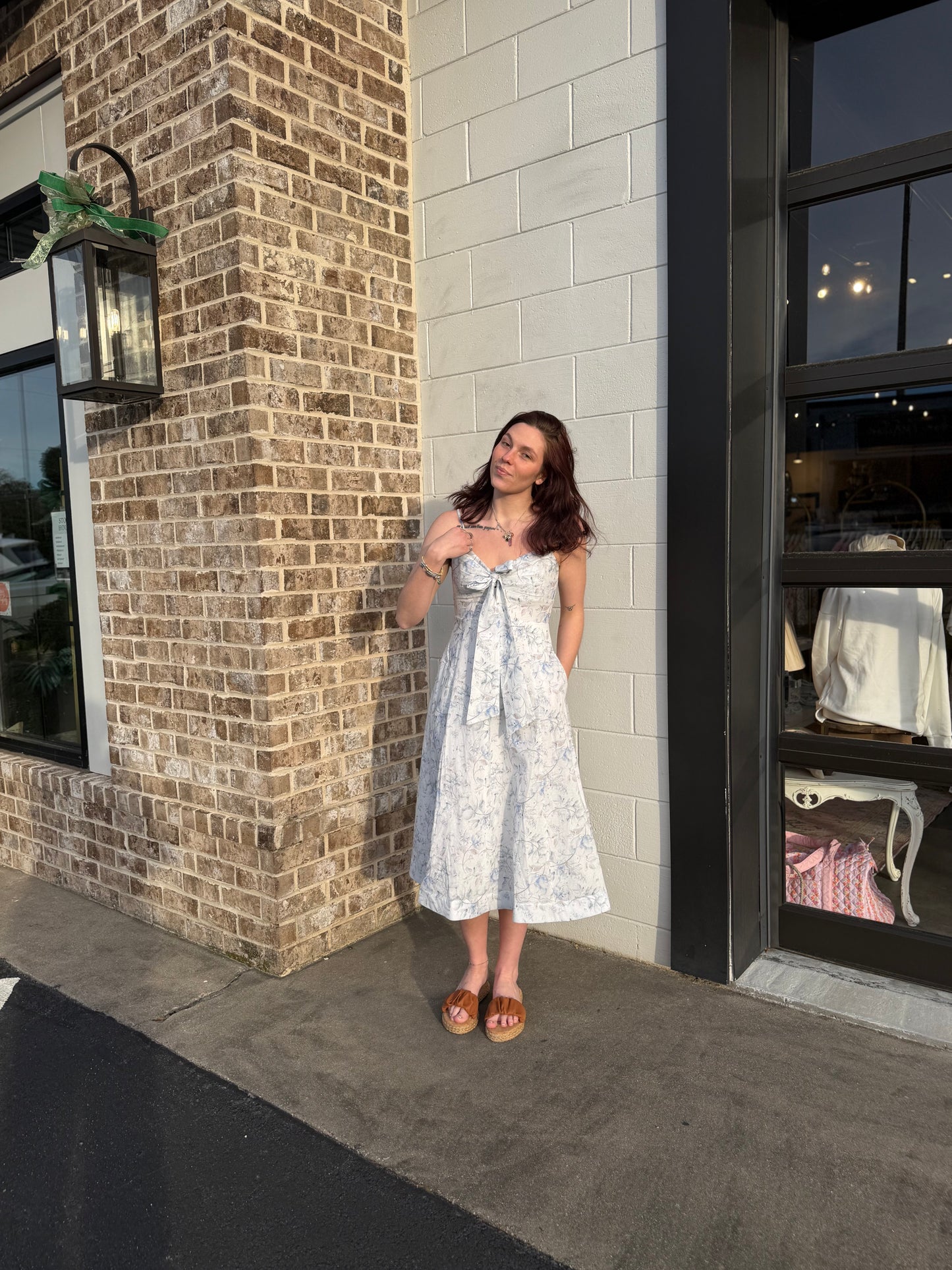 A Floral Printed Midi Dress With Front Tied Ribbon