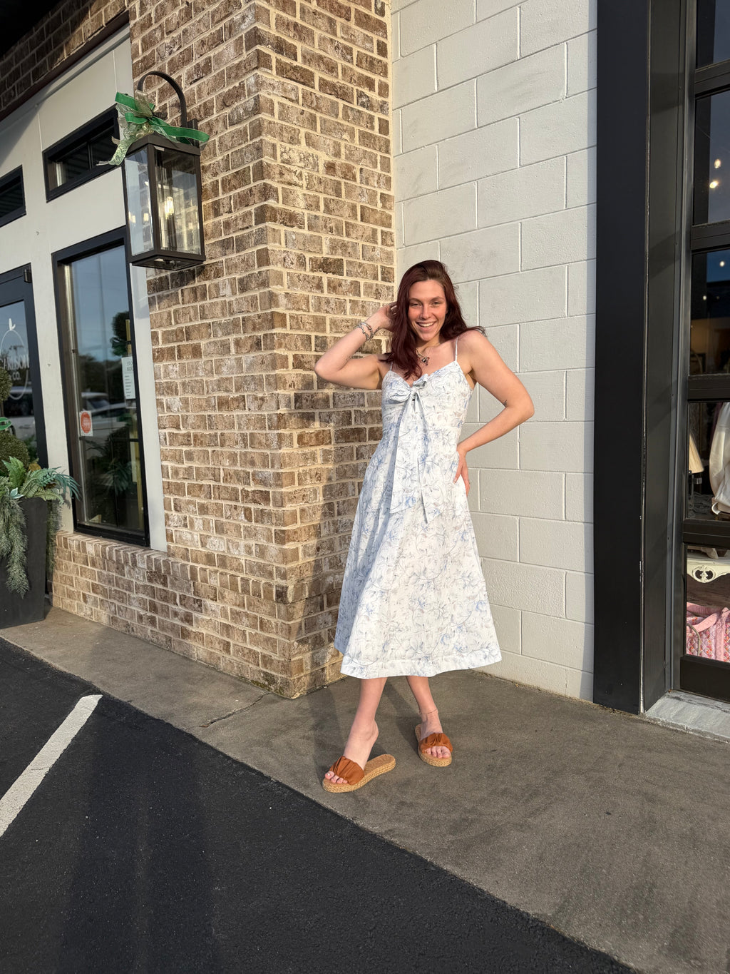 A Floral Printed Midi Dress With Front Tied Ribbon