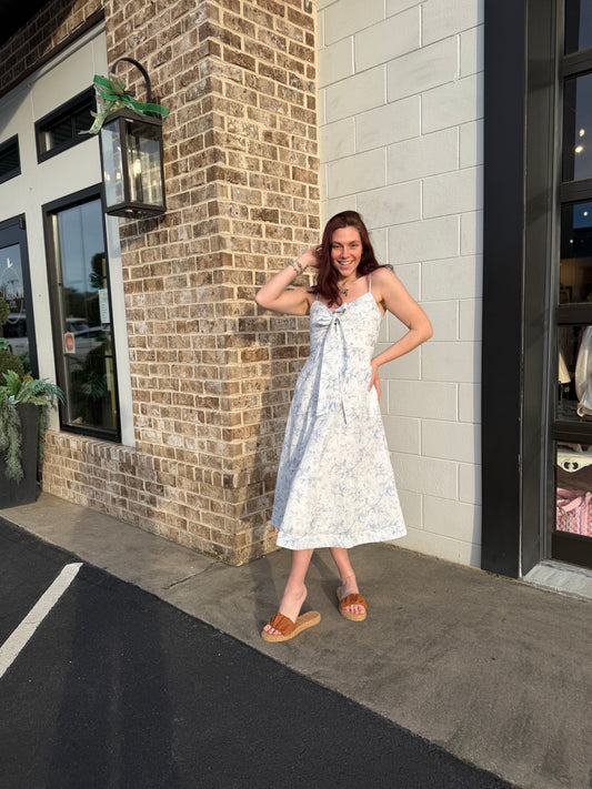 A Floral Printed Midi Dress With Front Tied Ribbon